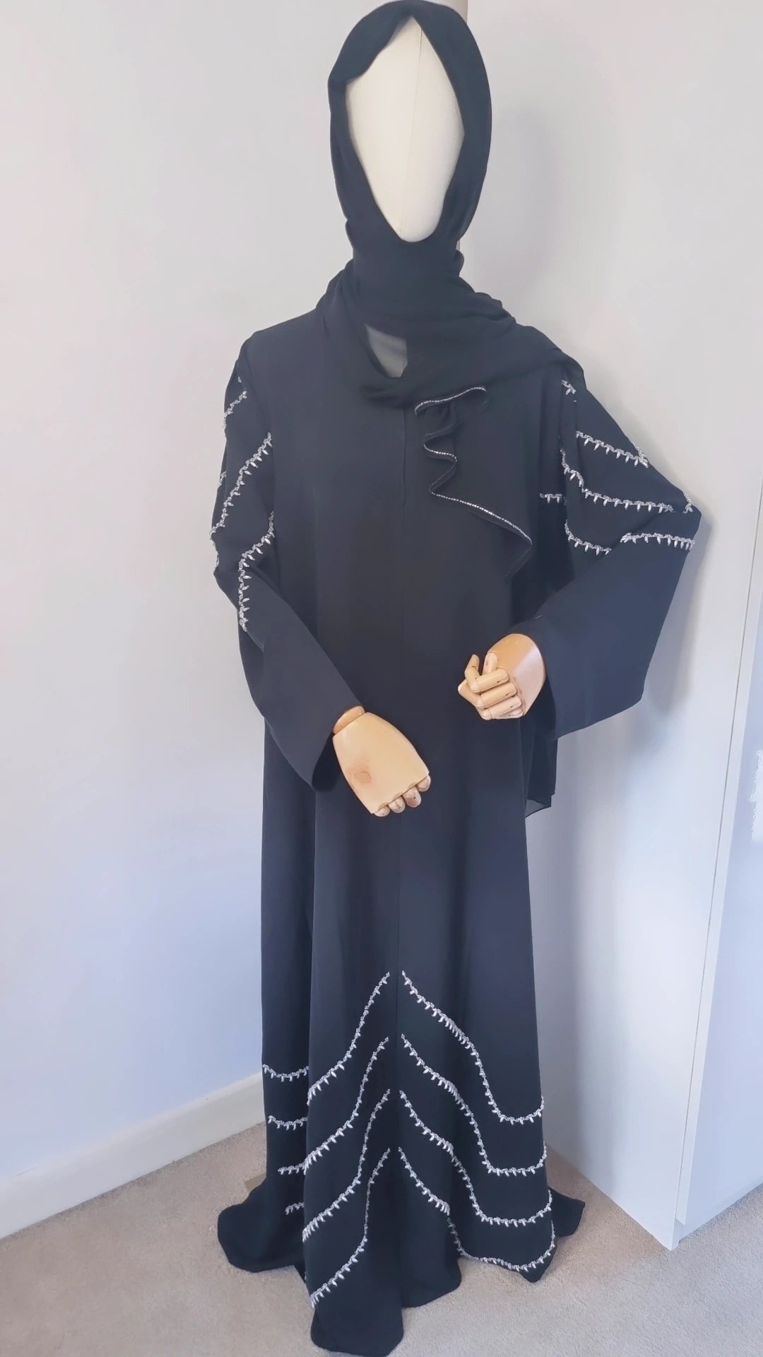 Black abaya with shoulder and bottom embellishments