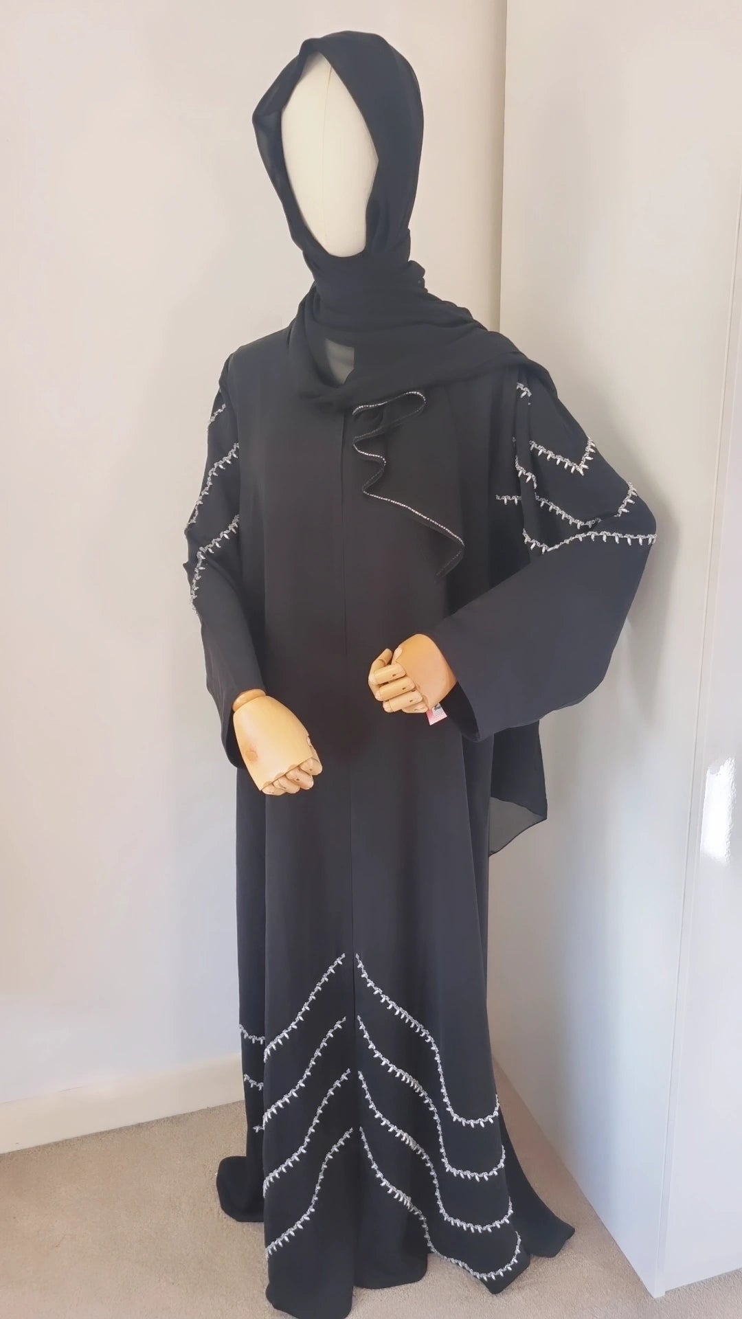 Black abaya with shoulder and bottom embellishments