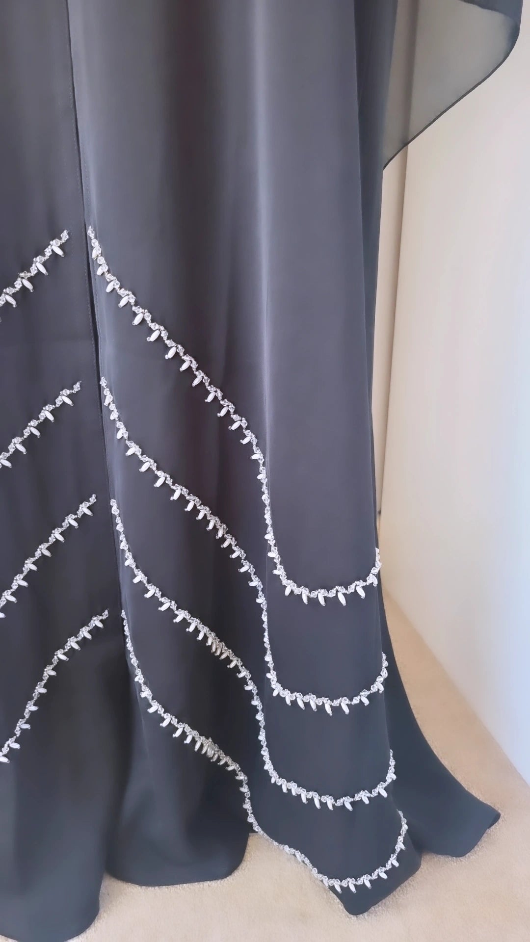 Black abaya with shoulder and bottom embellishments