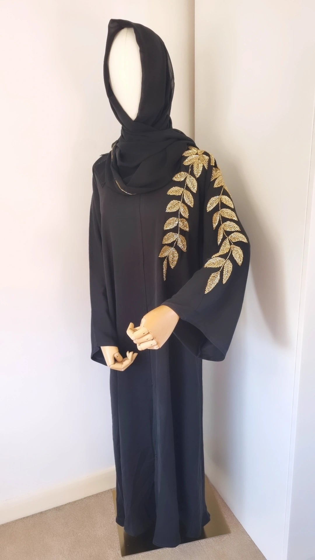 Black abaya with gold leaf embellishments