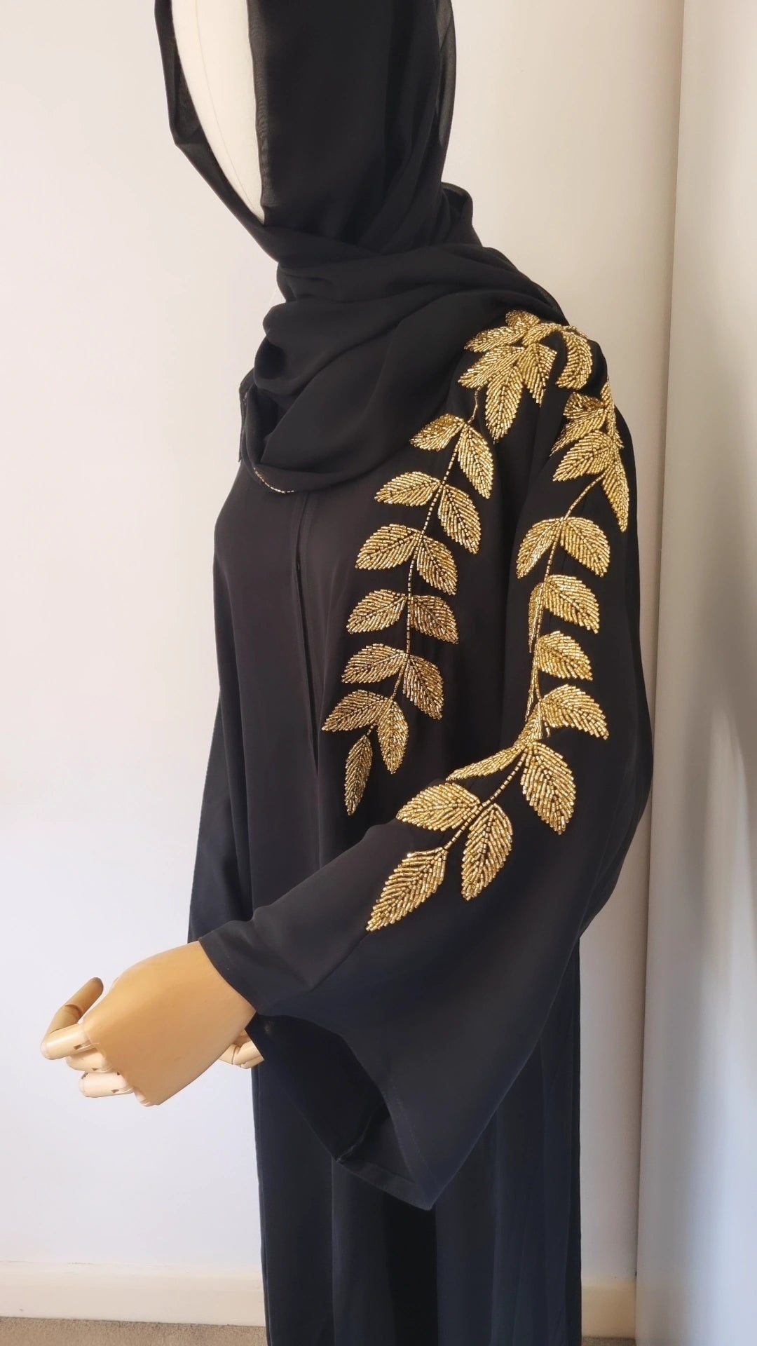 Black abaya with gold leaf embellishments