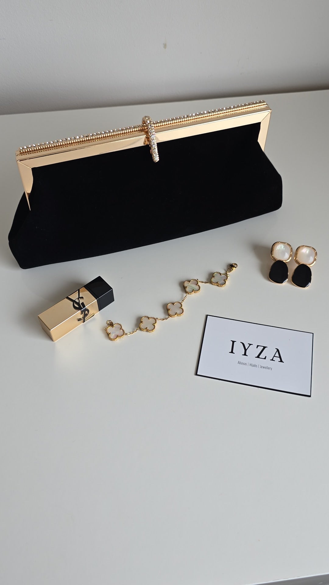 Black and off-white velvet clutch bags