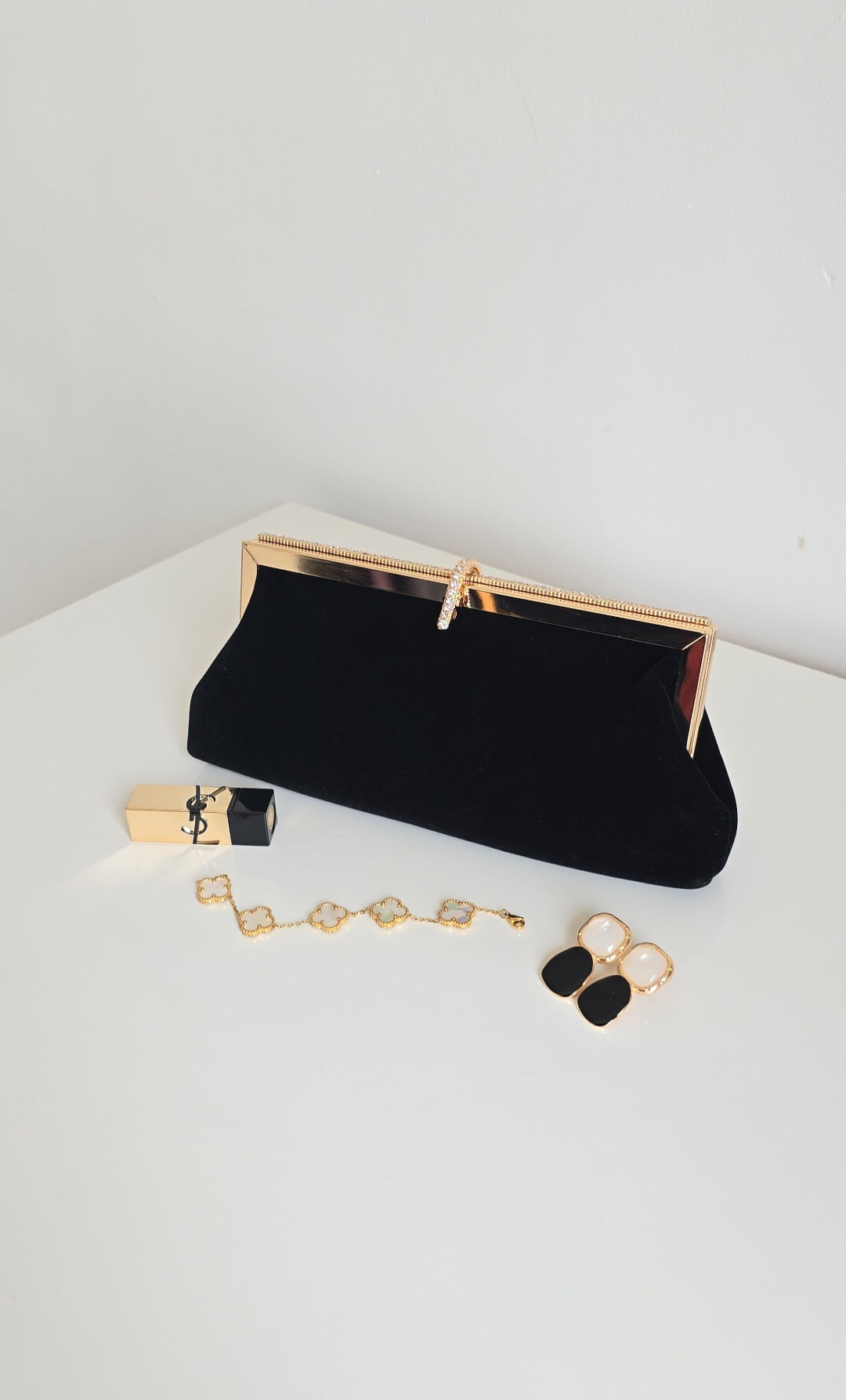 Black and off-white velvet clutch bags