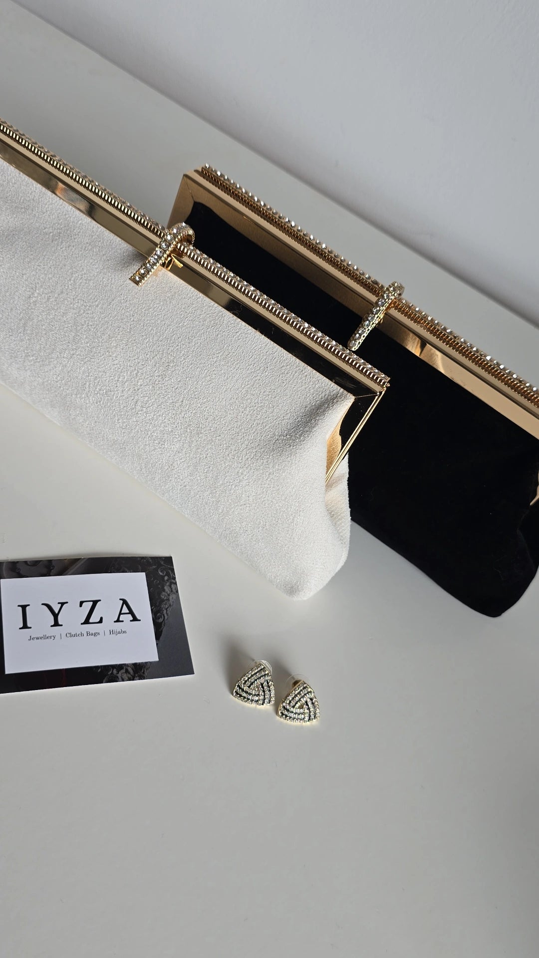 Black and off-white velvet clutch bags