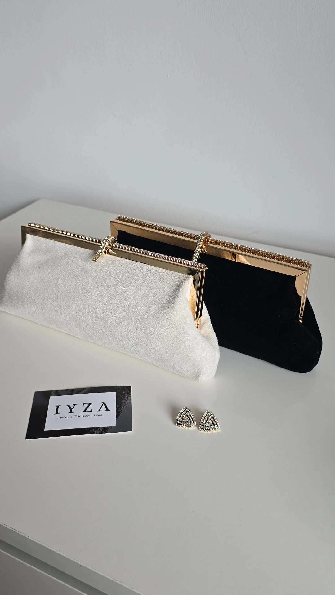Black and off-white velvet clutch bags