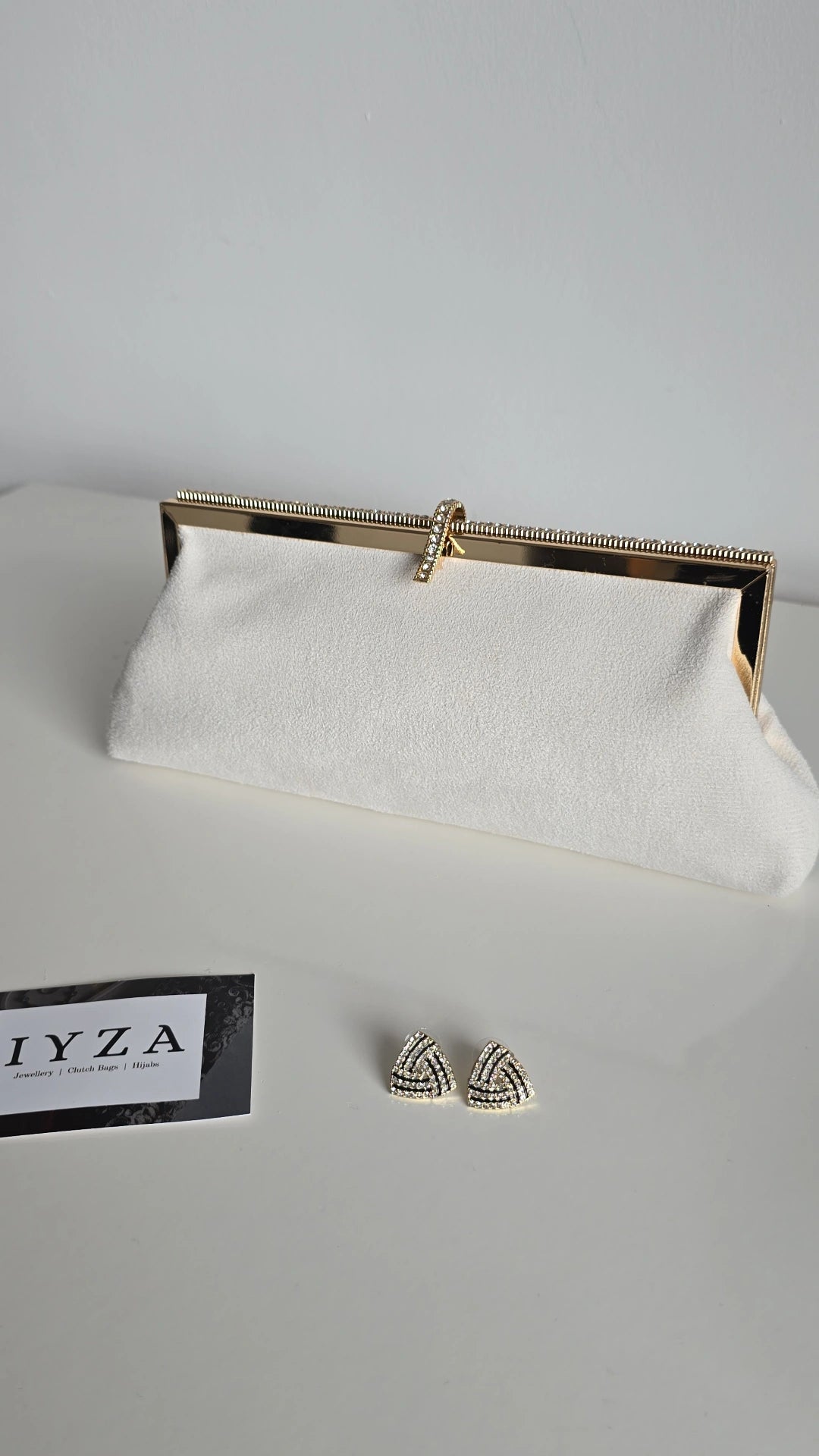 Black and off-white velvet clutch bags