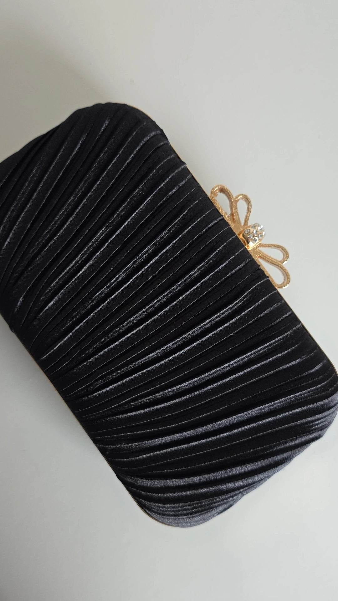 Black bow top clutch