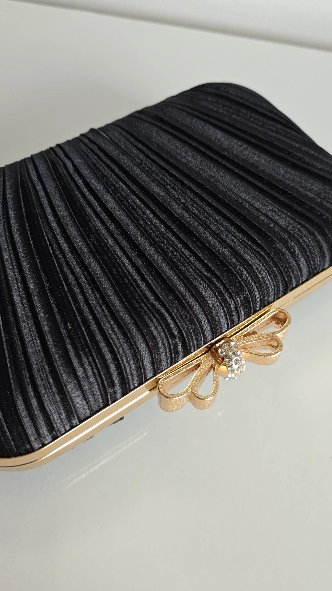 Black bow top clutch
