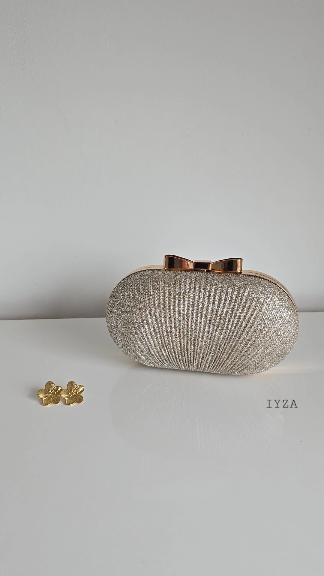 Sparkly bow top clutch bag