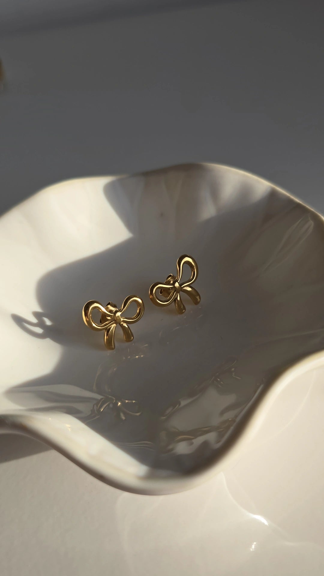 Gold plated bow earrings