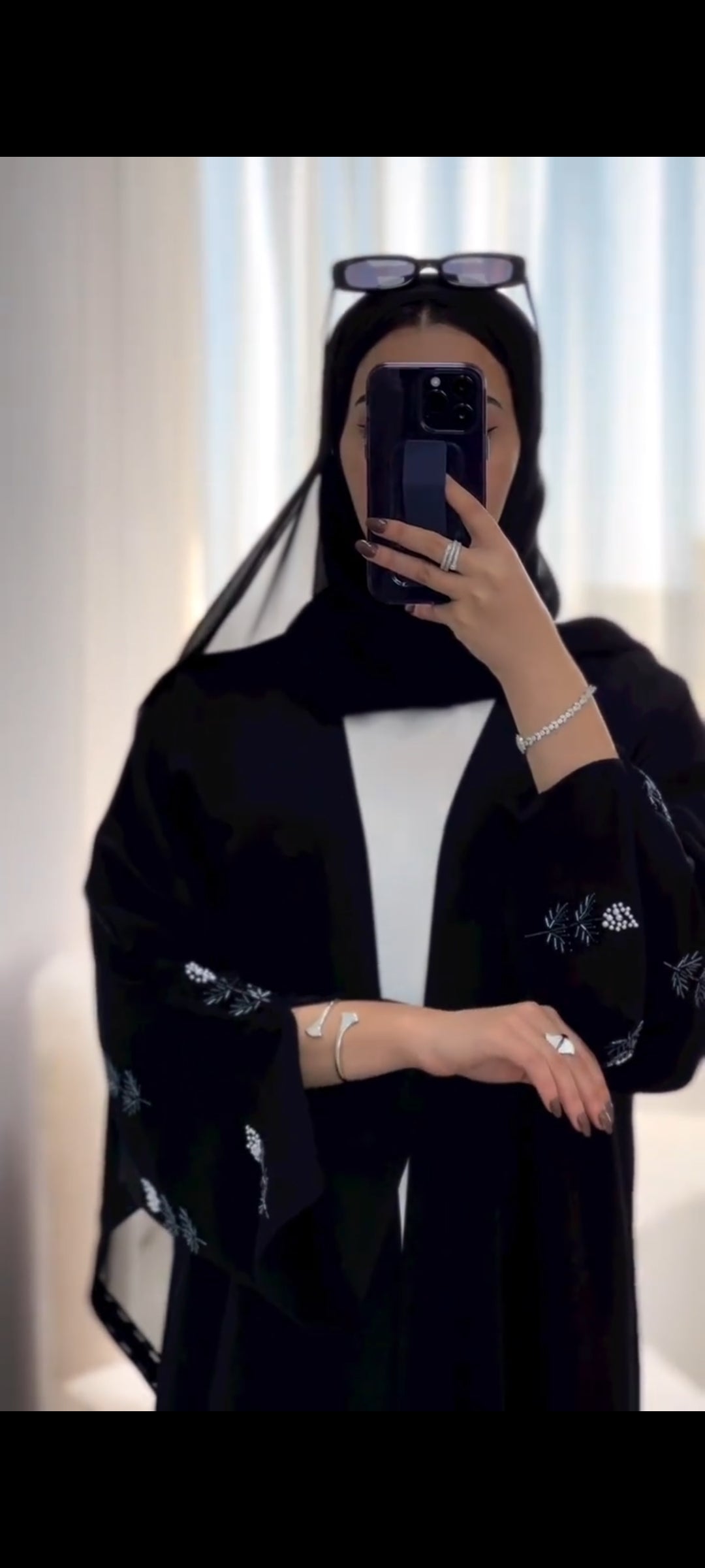 Black abaya with flower pearl details with white inner dress
