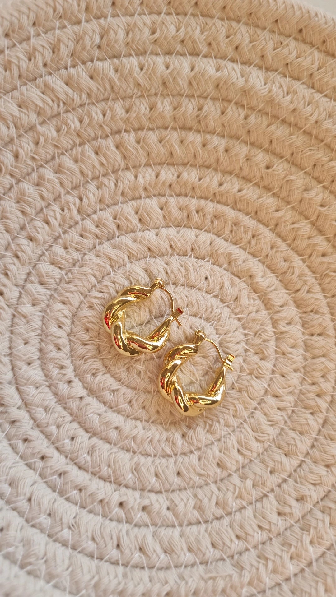 Gold metal swirl earrings
