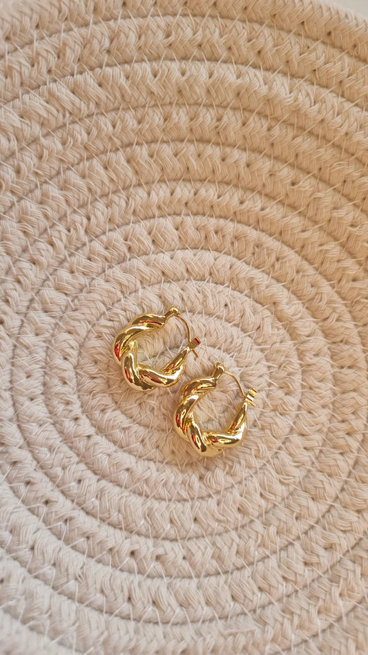 Gold metal swirl earrings