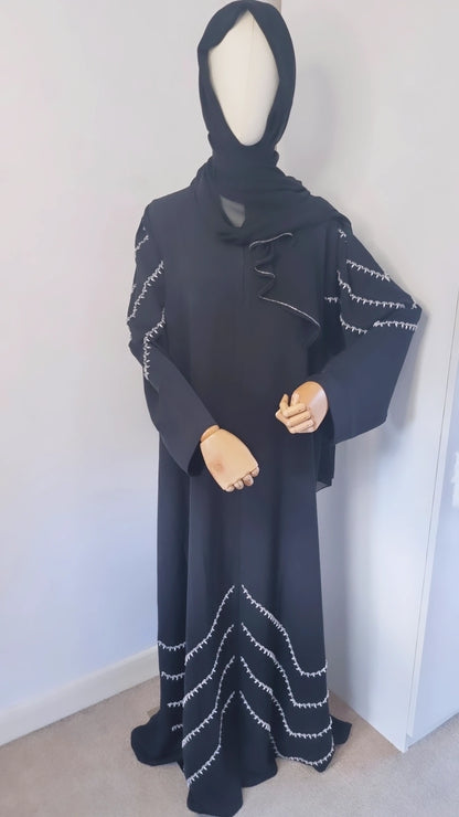 Black abaya with shoulder and bottom embellishments