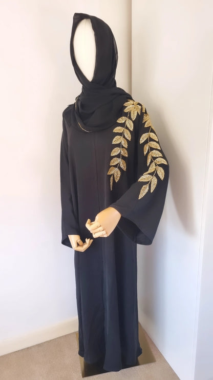 Black abaya with gold leaf embellishments