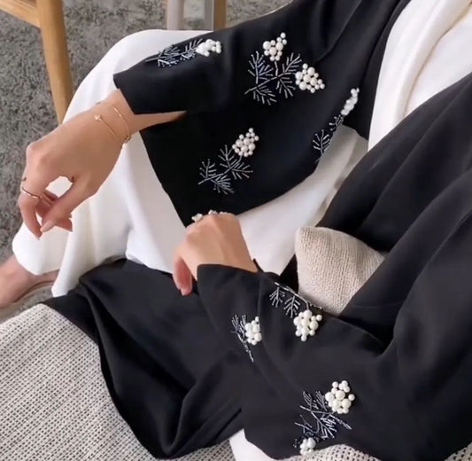 Black abaya with flower pearl details with white inner dress